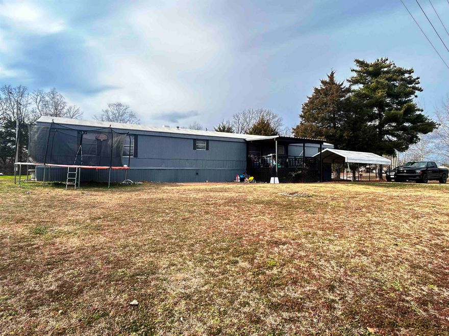 Well-Maintained Manufactured Home in Horseshoe Bend, AR  This well-maintained 16x65 manufactured home is conveniently located in Horseshoe Bend, Arkansas, just inside the Mobile Home Addition and directly across from a public park with playground equipment—perfect for families or anyone who enjoys nearby green space.  Situated on a nice corner lot, the property offers two driveways providing ample parking. Outdoor features include a storage building in the backyard, a small porch at the back door, and a large front deck ideal for grilling and enjoying the outdoors.  Inside, the home features a cozy gas log fireplace for comfortable evenings. The kitchen offers plenty of cabinet space, with appliances conveying including the refrigerator, range, and dishwasher. The primary bedroom includes a well-sized bathroom, while a full hall bath is located at the opposite end of the home, providing added convenience and privacy.  This would be great for "snow birders" as there is plenty of room to park a 5th wheer or camper. Great location, minutes to town and all amenities. Or a rental.   This move-in-ready home offers comfort, functionality, and a great location—don’t miss this opportunity!