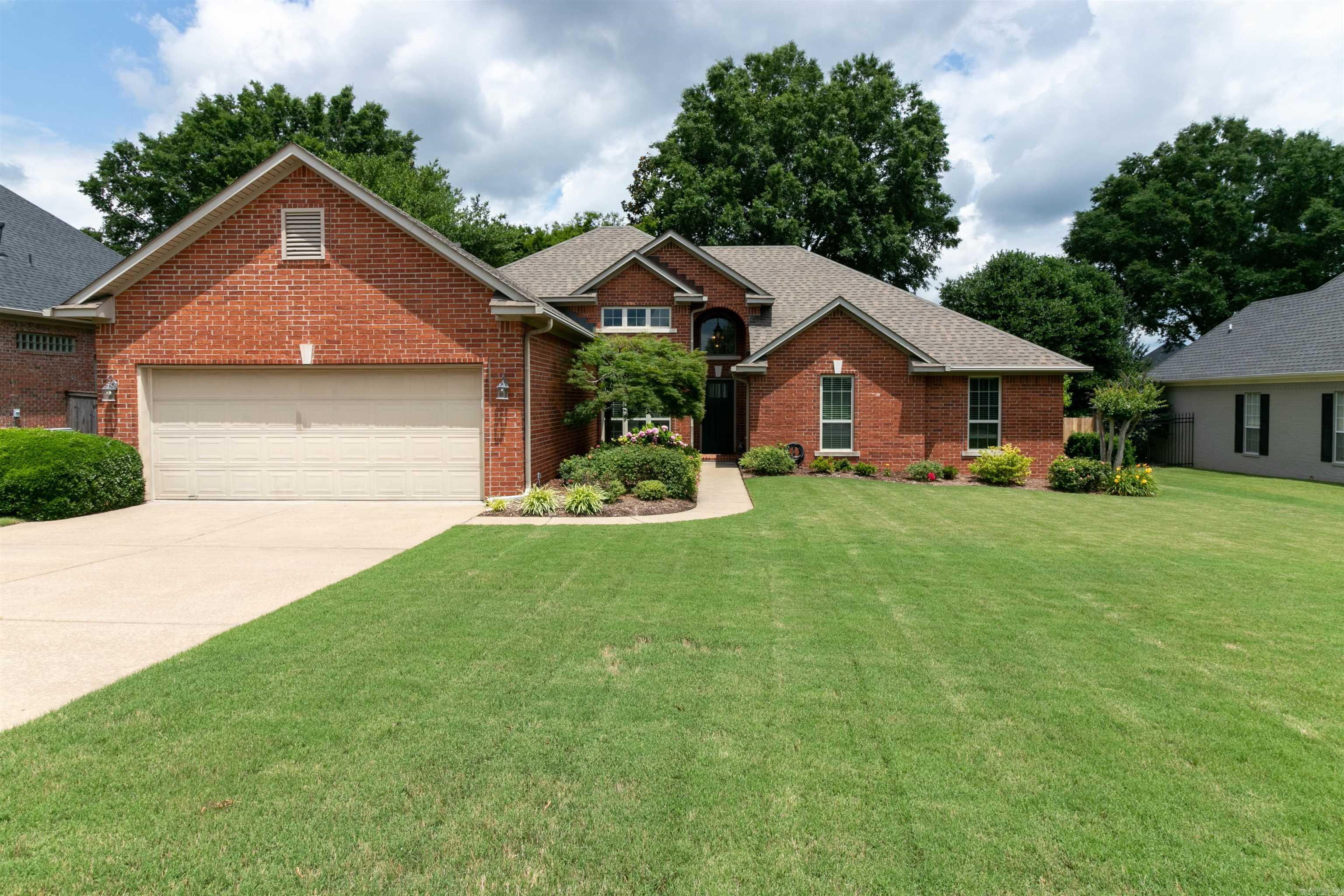 Beautiful home with 4 bedrooms, 2 bathrooms. Lovely tray ceiling in the large master bedroom and living area. There is a double fireplace in the living and dining area. Master bath centers a spa tub. There is a walk-in shower, tons of storage, and separate his & hers walk-in closets. This home has high ceilings throughout and lots of windows for natural light. The yards are professionally maintained with a prepaid yearly contract. The backyard is an oasis away from the day-to-day living. A pergola and patios make for a great entertaining space. The waterfall keeps the atmosphere going. Lots of gorgeous planting abound. You must see to appreciate!
