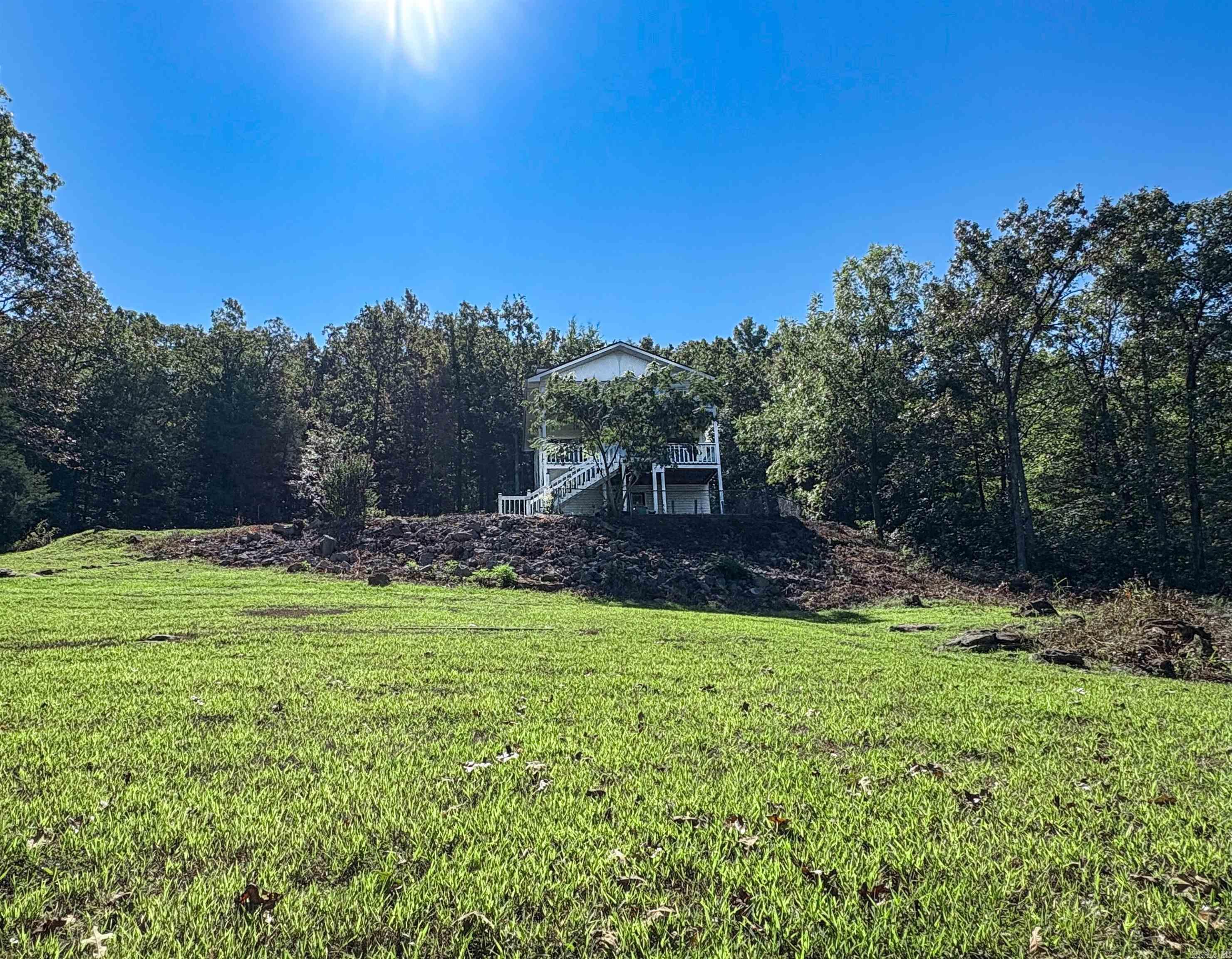 Enjoy the peace and privacy of country living just 7 miles from town! This charming 3-bedroom, 2-bath home sits on 4.58 acres offering plenty of space to roam, relax and enjoy nature. Home offers a newer roof (less than 3 years old), two decks perfect for entertaining or enjoying the view. Basement offers plenty of storage and a bonus room perfect for your hobby, exercise space or game room. Located 1 hour & 15 minutes to Branson Mo, less than 30 minutes to the beautiful Buffalo River, White River and Bull Shoals Lake. Easy access to entertainment, shopping and outdoor activities.