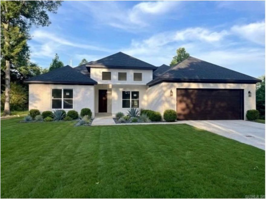 Stunning new construction on a spacious ½ acre lot, centrally located less than 10 minutes to Conway & I40 and 5 minutes to Greenbrier! This beautifully designed 4-bedroom, 2-bath home offers an open and inviting layout with high-end touches throughout. The living room features a cozy gas fireplace with custom floating shelves, creating the perfect focal point for the space. The kitchen is a dream for cooking and entertaining with a large center island, gas range, and hidden walk-in pantry that keeps everything organized while maintaining a clean, modern look. The desirable split floor plan provides privacy for the primary suite, which includes a spacious bedroom and a large walk-in closet with built-ins for ultimate storage & functionality. With thoughtful design, stylish finishes, and plenty of outdoor space on ½ acre, this home blends comfort, functionality, and modern charm — the perfect place to call home. Scheudle your showing today!  (grass/landscaping digitally enhanced by AI)