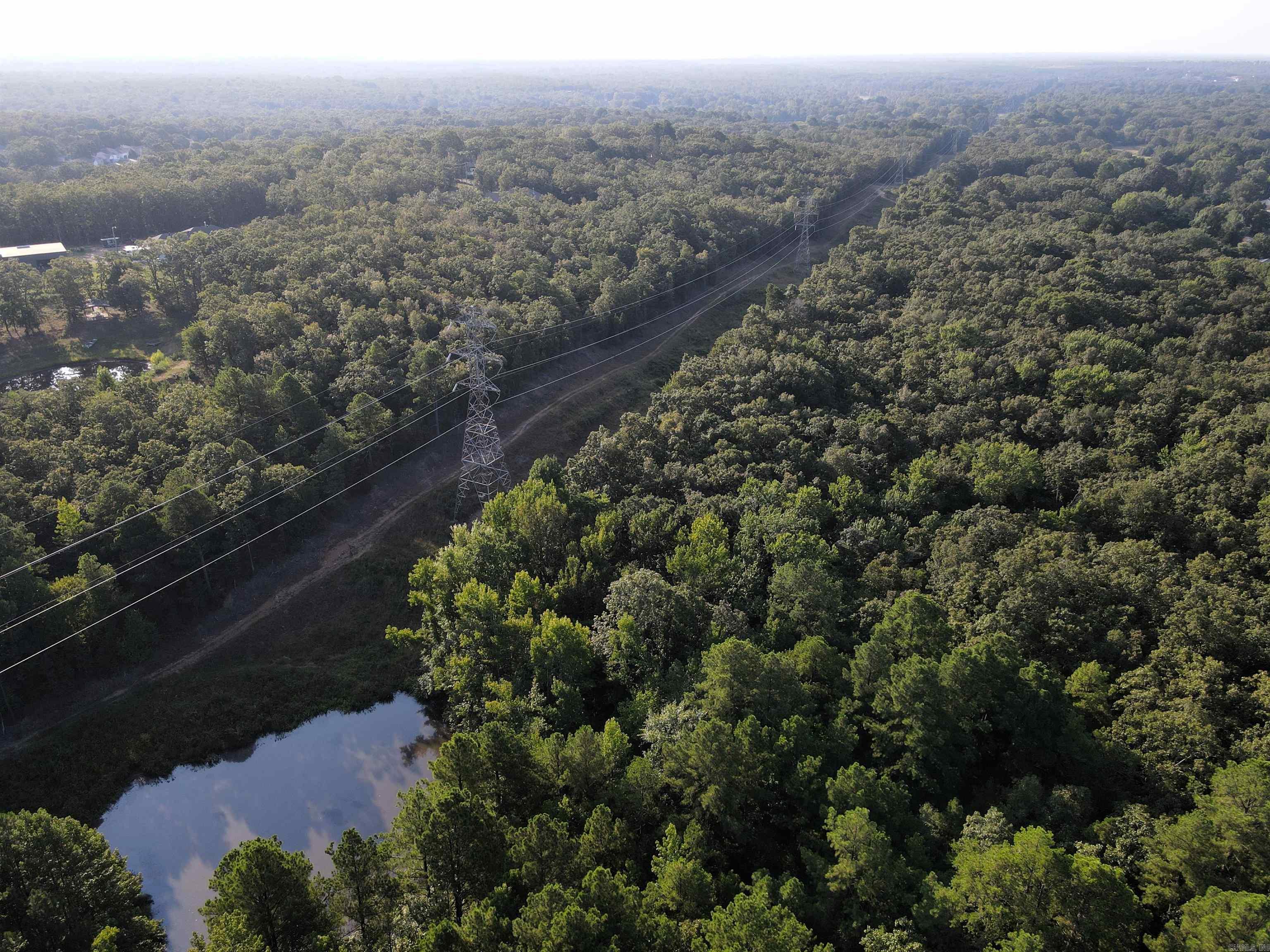 - 23.7 +/- acres - Numerous build sites - Utilities on the property - Mature hardwood mix - Tons of wildlife - Easement access - Great topography - Pond - 5 miles to Jacksonville - 5 miles to Sherwood