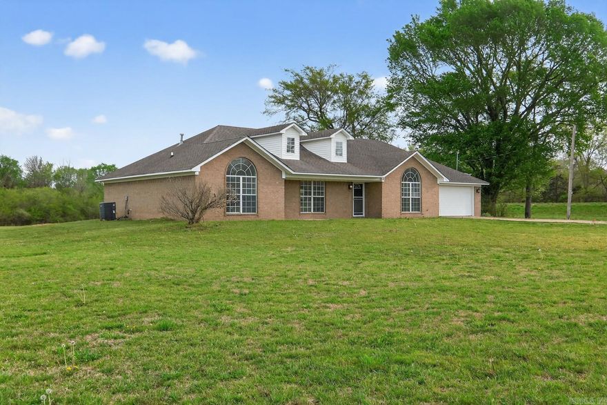 You've been waiting for this private Arkansas retreat set on over 3 beautiful acres. This spacious home has been extensively refreshed and thoughtfully upgraded, offering a rare combination of comfort, space, and value.The interior has been professionally painted throughout, creating a bright and inviting feel from the moment you walk in. Brand new luxury vinyl plank flooring adds modern style while providing long-lasting durability.The primary suite offers a refined retreat within the home. The bathroom has been thoughtfully updated with a newly installed tub and shower, complemented by refreshed finishes that give the space a clean, modern feel. The result is a comfortable and polished environment designed for relaxation at the end of the day.The kitchen has also been updated with refreshed countertops, making it both functional and welcoming for everyday living and entertaining.Outside, the expansive 3+ acre lot offers endless possibilities for outdoor living, gardening, recreation, or future additions.With its size, upgrades, and acreage, this home is priced well below current market value, making it an exceptional opportunity you will not want to miss.