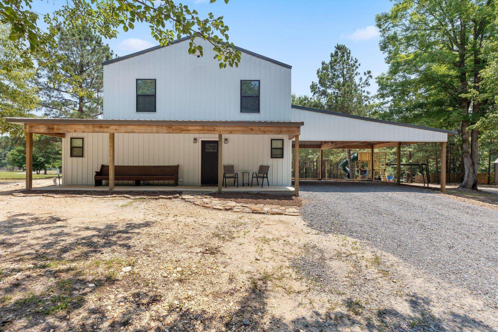 Sitting on 5 level acres, this fully updated home has space to spread out, inside and out. The main house is full of natural light—especially in the spacious living room—and features modern finishes throughout. The kitchen is a true highlight, featuring butcher block countertops, a stylish backsplash, and plenty of cabinet space. The owner’s suite is conveniently located on the main level, complete with a private bathroom that includes both a soaking tub and a walk-in shower. Upstairs, you'll find two additional bedrooms plus a second living room or flex space—perfect for a game room, office, or lounge. Outside, you've got two large shops ready for projects, storage, or business use, plus a fully separate accessory dwelling unit (ADU) that makes a great guest house, rental, or in-law setup. Peaceful setting, updated home, and all the space you could ask for—just minutes from town.