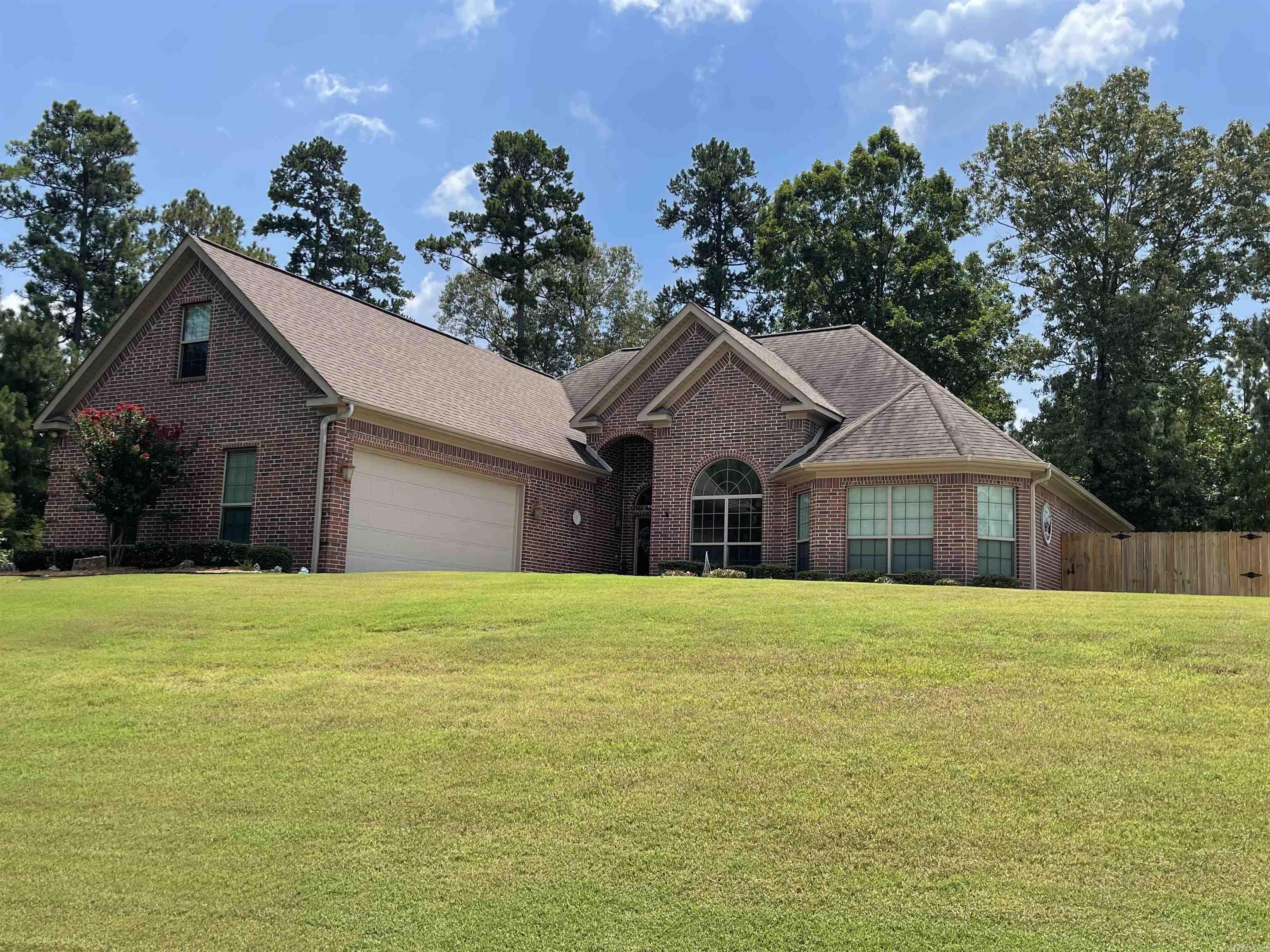 Great home with a split bedroom plan, large upstairs suite with full bath. Primary Suite is downstairs with large bath with shower and tub. Huge Walk-in closet. There is a covered patio for outside entertaining. I