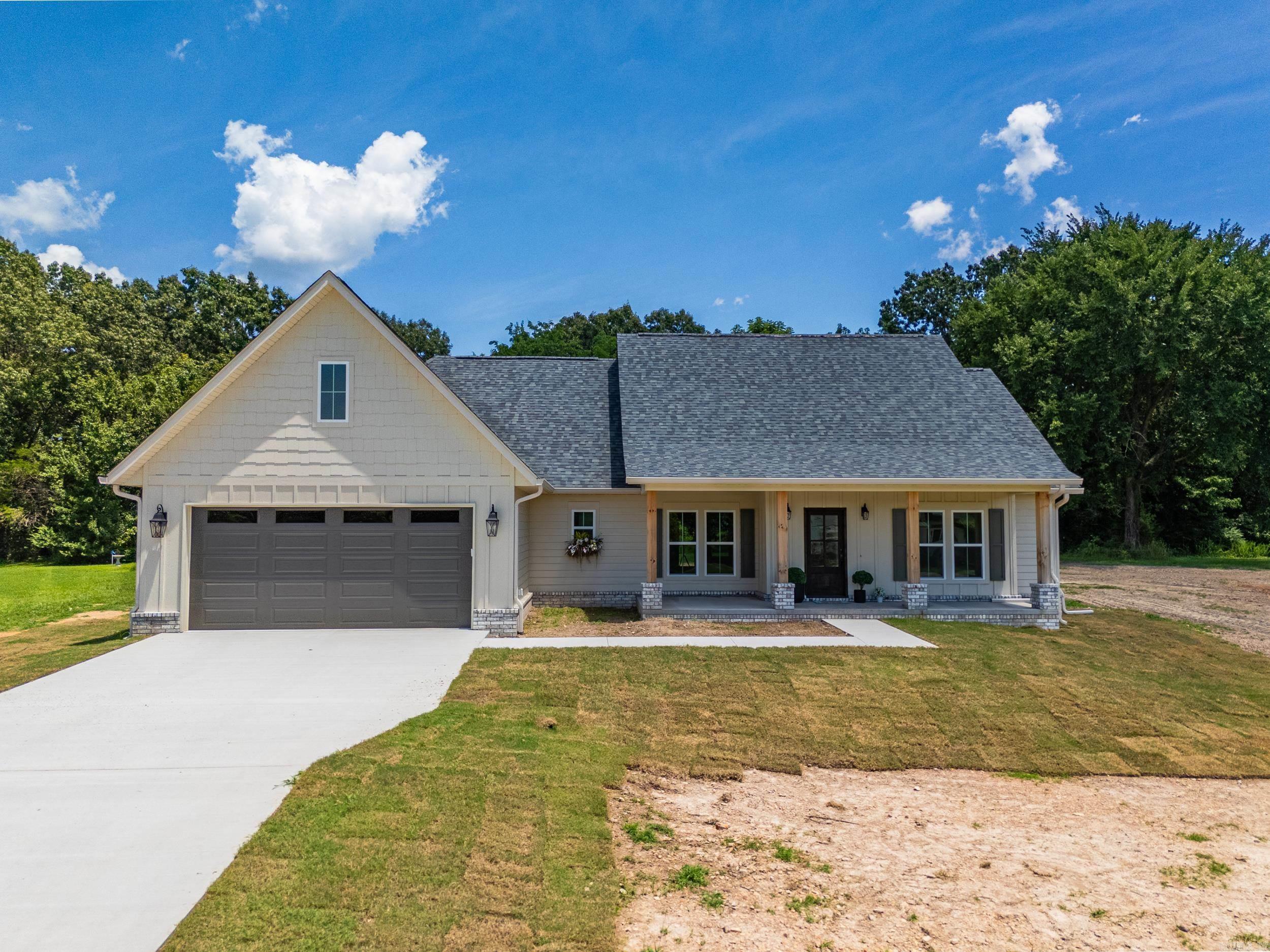French Country Elegance Meets Modern Comfort! This stunning new construction in one of Mountain Home’s top neighborhoods features 4 beds, 2 baths, and 2,160 sq ft of refined living on a .67-acre lot. Blending French Country charm with modern flair, it boasts custom cabinetry, quartz counters, vaulted ceilings, engineered hardwood, and a cozy gas fireplace. The split floor plan includes a luxurious primary suite with a soaker tub, walk-in shower, and oversized closet. Enjoy a bonus room, home office, large pantry, and covered back patio—perfect for entertaining. Cedar columns, a covered front porch, and 2-car garage complete the home. Just minutes from Norfork Lake, White & Norfork Rivers, the hospital, and the Baker Historic District. Don’t miss this one-of-a-kind home!