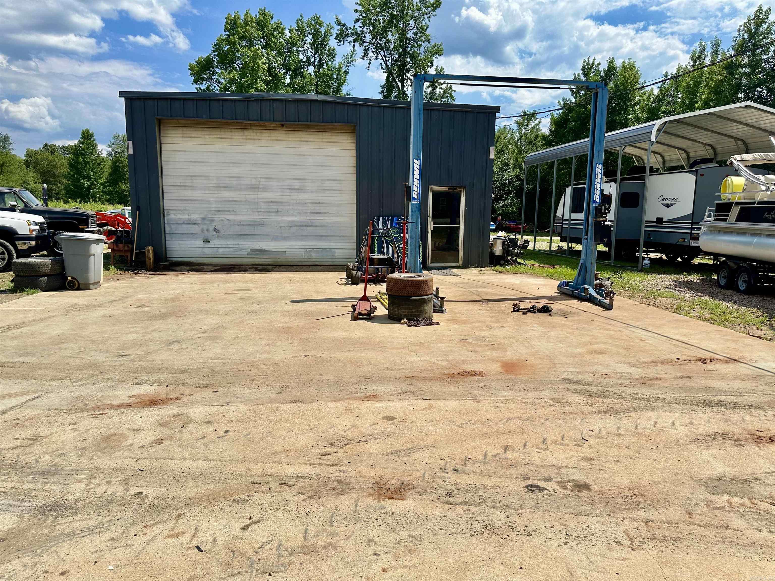 Commercial Opportunity in the Heart of Glenwood! This 1.30± acre commercial property features a 1,518± sq ft multi-purpose shop equipped with an automotive lift, air compressor, 3-phase electrical hookup, outdoor security lighting, office space, and a restroom. The spacious parking lot includes 12 designated spots designed for heavy equipment, semi-trucks, and trailers — currently generating rental income. Ideal for business owners or investors seeking a flexible space with income potential. Building and land are included in the sale.