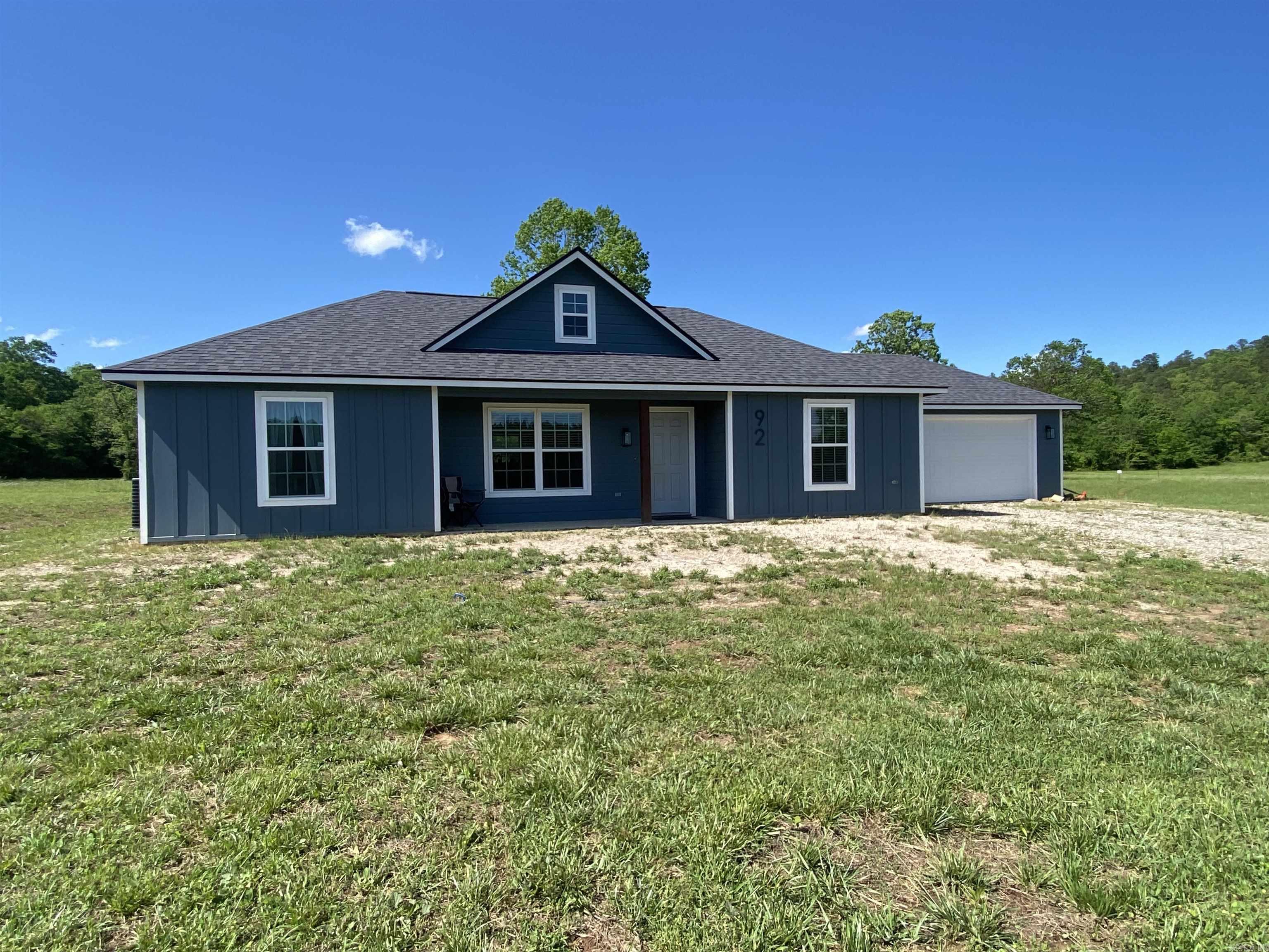 Looking for a new house? Here it is! This 1408 square foot home has only been lived in for approximately 1 year, so it is basically new! Beautifully finished with luxury bamboo, ceramic tile (floors and backsplash), granite countertops, and stainless steel appliances. 3 bedrooms and 2 baths with walk-in closets and large laundry room with storage. The large kitchen island is a central focal point to the open concept floor plan, perfect for entertaining and conversation. The property has 3.7 acres m/l and is located in Reva's Retreat Subdivision. Reva's features a common area for owners on Irons Fork, a year around creek flowing into Lake Ouachita. Also, a tractor and the home furnishings are available at an additional cost. Don't miss out on this place! It would make a perfect home for your family or to get ready for retirement. $275,000.00