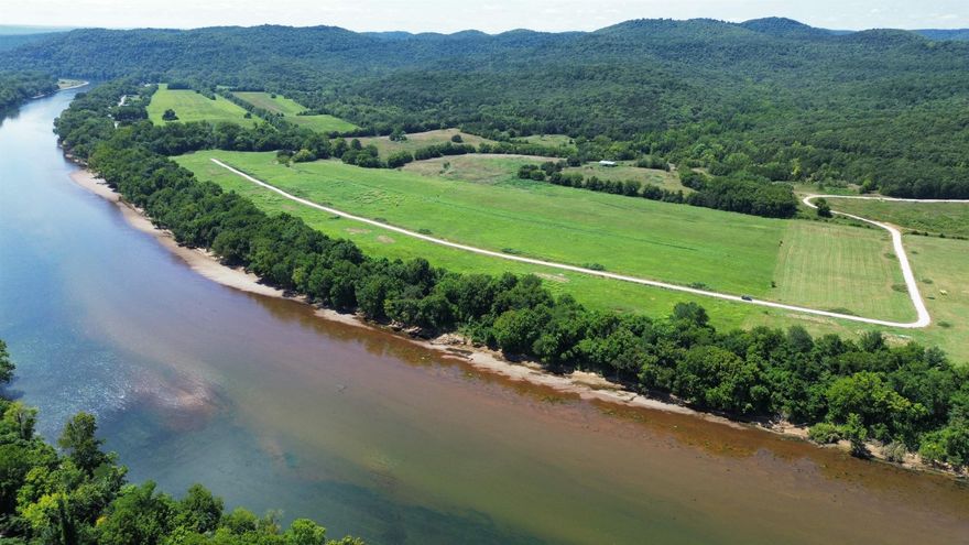 This is a beautiful 1 acre riverfront tract on the White River with 130 feet of river frontage. The property is just 2.5 miles up Hwy 5 from Anglers Restaurant & Trout Dock and 1.5 miles from Jack’s Trout Dock and Jo Jo’s Catfish Restaurant. It’s also conveniently located near the Ozark National Forest, the Ozark Folk Center, and Blanchard Springs Caverns. It’s approximately 7 miles north of Mountain View. The cleared section of land makes for an ideal building site, while the high bank offers big and pretty timber sloping gently down to the river.  Whether you’re looking to build a home, or cabin retreat, this scenic 1 acre tract provides the perfect setting and location to all the good attractions to see at Mountain View, Arkansas. Priced at 85,000, for a limited time. The owner is also offering financing on this tract of land, with 15% down payment.