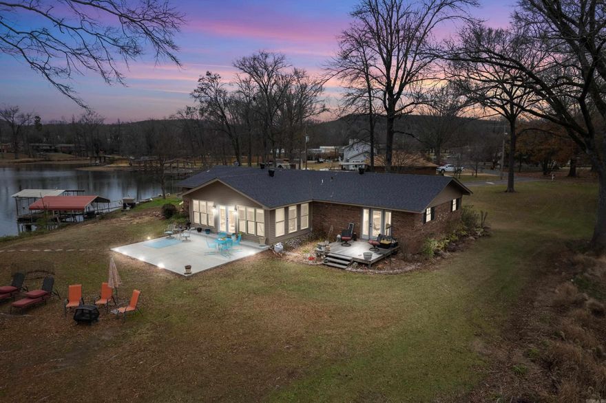 Lakefront Paradise on Lake Catherine just 8 minutes from Lakeside School and 15 minutes to beautiful downtown historic district of Hot Springs National Park. Experience serene lakeside living with this stunning Lake Catherine home, boasting over 250 feet of prime lakefront point property enjoying year-round water levels. Perfect for fishing enthusiasts and nature lovers, this 3-bedroom, 2-bathroom retreat features an open-concept design that seamlessly combines comfort and style. Enjoy breathtaking lake views from the spacious sunroom, filled with natural light that highlights the home’s inviting interiors. Whether you’re entertaining in the open living spaces or relaxing by the water’s edge, this home offers the ideal blend of tranquility and modern convenience. The newly built 2 stall boat dock is great for the fishing boat and your cruising pontoon boat. Don’t miss your chance to own this rare gem with exceptional lake frontage and year-round outdoor enjoyment.