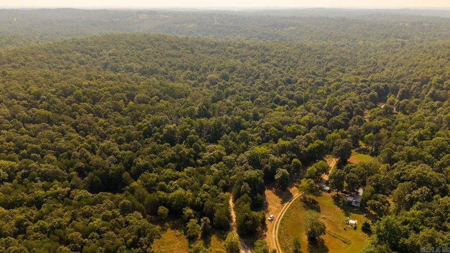 Wooded acreage for sale near Lake Norfork Discover 10 acres of Ozark beauty just outside Mountain Home, AR. This mostly wooded property features marketable hardwoods, open timberland ideal for hunting, and two wet-weather creeks that add charm. A cleared, level area near the county road provides the perfect spot to build, camp, or set up an RV, with electric access available for easy development. Wildlife is abundant, including whitetail deer and other game, making this a hunter’s dream. Located just one mile from East Pigeon Creek and five miles from Lake Norfork’s Pigeon Creek access, you’ll enjoy endless opportunities for fishing, boating, and lake living. Nearby Mountain Home offers dining, shopping, and attractions such as Bull Shoals-White River State Park, Blanchard Springs Caverns, and the Norfork National Fish Hatchery. Perfect for a home, retreat, or recreational getaway, this property puts the best of the Ozarks within reach.