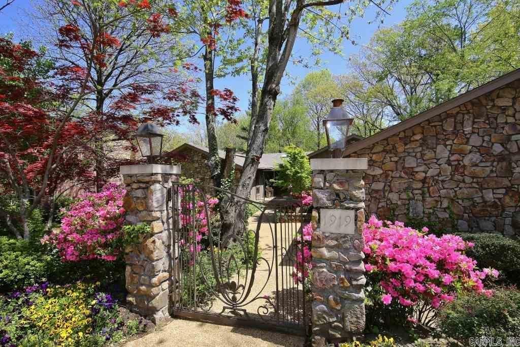 Exceptional home nestled in a beautiful backyard wooded setting. Excellent Heights location, one block from the Country Club of Little Rock. A multitude of windows allows fantastic light filled spaces. The primary bedroom plus and an additional ensuite bedroom is on the main level. Primary bedroom has an outstanding bathroom with three closets, built in dressers and two vanities with an abundance of counterspace. This home has 3 living areas, 3 fireplaces, an office/drop space with great cabinetry off of the two car garage. Large laundry on the main level with 2nd sink and space for 2nd refrigerator. Some outstanding features are: open flowing floor plan, spacious living and dining areas, a large redone gourmet kitchen, breakfast table space, gorgeous vaulted ceilings, double glass door entry into the foyer, and a trek deck off the main level. Two more bedrooms and one bath down plus a living space with fireplace. Another level of decking is off of this level. Sellers have floor plans to expand home if interested. If you are the market for a new home and wish to be in the Heights, please take the time to see this remarkable home!