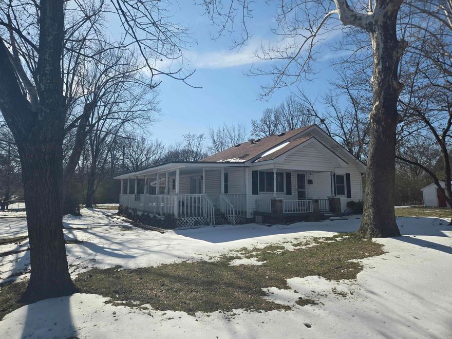 This home is priced to sell and sits right in the heart of town! Featuring 2 bedrooms and 2 bathrooms, it offers a huge covered porch perfect for relaxing, along with a good-sized mudroom for added convenience. Outside, the property includes a covered storm shelter, RV hookup, and an air-conditioned shed/garage—great for storage, hobbies, or a workshop. The home does need some attention, including cleaning and possible updates to the kitchen and bathroom fixtures, making this a great opportunity for buyers looking to add value and make it their own.
