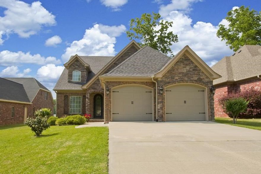 CUSTOM BUILT ON LAKEFRONT!  Chef's kitchen with 5 burner cooktop, island w/sink, custom cabinets w/pull outs, breakfast bar. Vaulted ceiling in Living room with 12 ft rock fireplace. Master closet opens to dream laundry room, which opens to hall. Hardwood floors throughout entire home. Beautiful view of open water from level backyard, private covered boat dock, sea wall, outdoor fireplace on covered porch. Central vac, gutters, sprinklers, alarm system...too many extras to list!