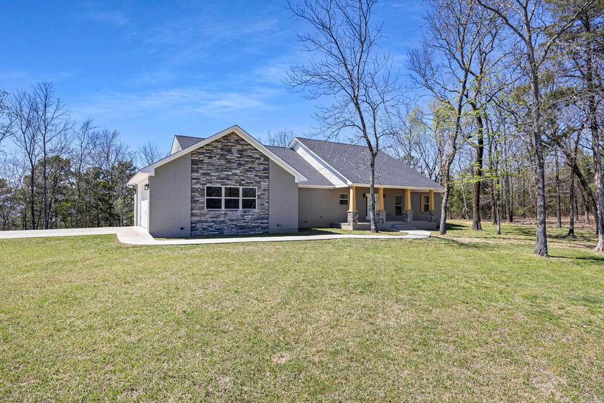 Come see this beautiful new build single level home on a prime $72k lot with a VIEW! This artfully designed home sits on 2+ acres in the foothills west of Crow Mountain with a tremendous view of Mt Nebo to the west, which you can enjoy from the comfort of your great room or your large back patio. Light colored wide plank oak floors and tasteful warm neutrals compliment the natural forest backdrop provided by the oversize picture windows in the Kitchen/great-room, with Granite throughout, and a jack & Jill bedroom wing making up one side with the master suite boasting a large walk-in shower, custom makeup vanity and a huge master closet with a separate exit to the back patio on the other.
