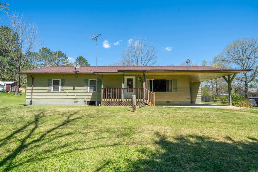 Peaceful country living awaits as you pull down the dirt road drive to this charming 3 bedroom 2 bath home in Royal, Arkansas. Step inside to discover a world of rustic elegance, where every corner tells a story. From the inviting warmth of the wood-paneled living spaces to the quaint details that adorn each room, this home is a testament to timeless beauty and unique character. Outdoor features include a 24x20 workshop, well house, propane tank, wheelchair accessible entrances, and an additional 12x9 storage room, all situated on 1 spacious acre located just a short distance to Brady Mountain Recreational Area and the Ouachita Mountains.