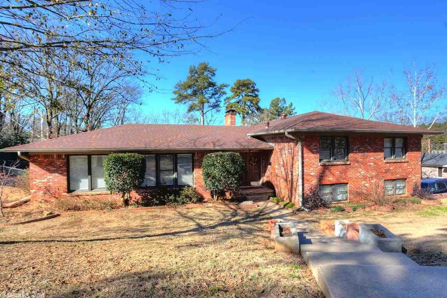 Live comfortably in this stylish 5 bedroom/3 bath mid-century modern home. Great layout and open feel, numerous updates, lots of storage & a central location. Updates include: 30-year architectural shingle roof, new HVAC, electrical upgrades & new light fixtures. Kitchen has stainless appliances & opens to a cozy hearth room. Large downstairs den also has a fireplace. Master suite, 3 bedrooms + bath are on one level, separate from the guest bed/bath. Agents see remarks for exclusion.