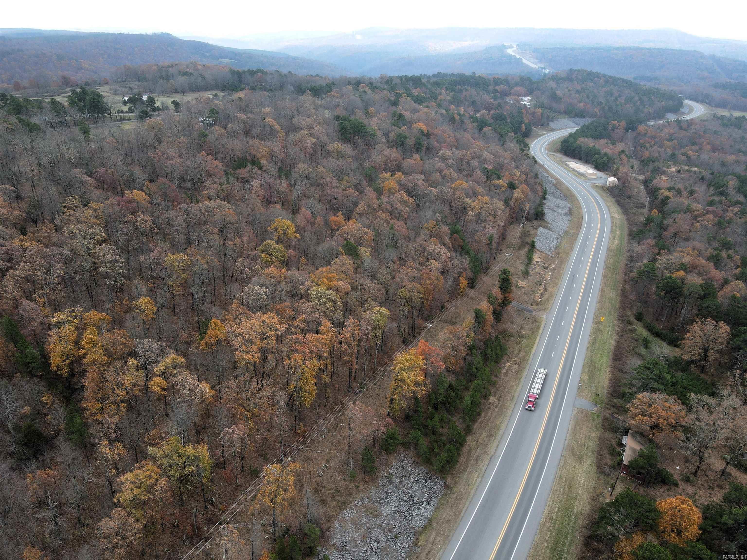 - Hilltop build site - Beautiful views - Rolling topography - Utilities on or near the property - Mature hardwood trees - Healthy deer and small game populations - US-65 frontage - No restrictions - Outside city limits - 10 miles to Clinton - 30 miles to Buffalo River