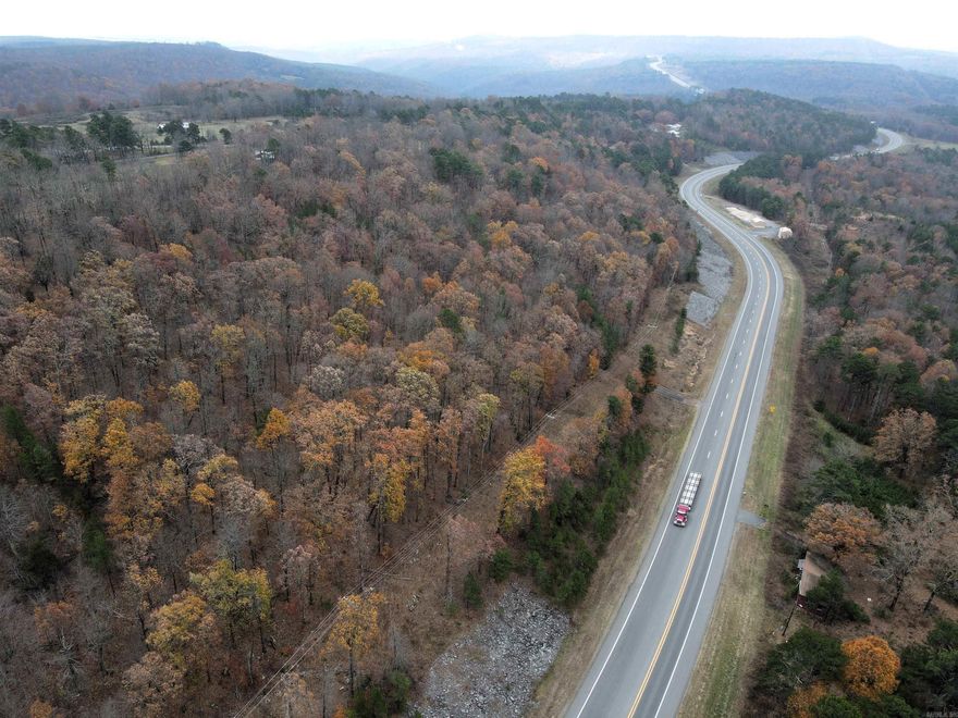 - Hilltop build site - Beautiful views - Rolling topography - Utilities on or near the property - Mature hardwood trees - Healthy deer and small game populations - US-65 frontage - No restrictions - Outside city limits - 10 miles to Clinton - 30 miles to Buffalo River