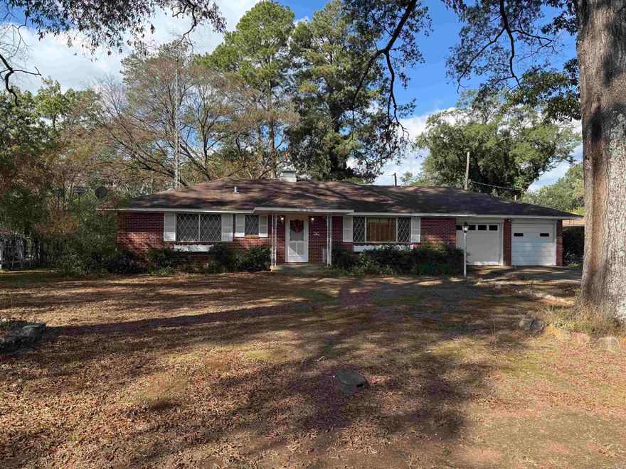 Spacious brick home in the Heart of Murfreesboro, with-in walking distance to schools, offers over 2000 sq ft of living space.  4 bedrooms and 3 full baths, living room, kitchen with electric stove, new dishwasher, new disposal and refrigerator to convey.  Dining area with built-in cabinets and display shelving, sewing closet, den with fireplace, currently w/gas logs, and bonus room currently a dark room for photography work.  Double garage with built in storage and access to backyard, detached garage/shop with electricity, fully fenced backyard w/wood privacy fence, and a oversized covered patio, great for enjoying the private yard.  For more details or to schedule a showing, contact our office.