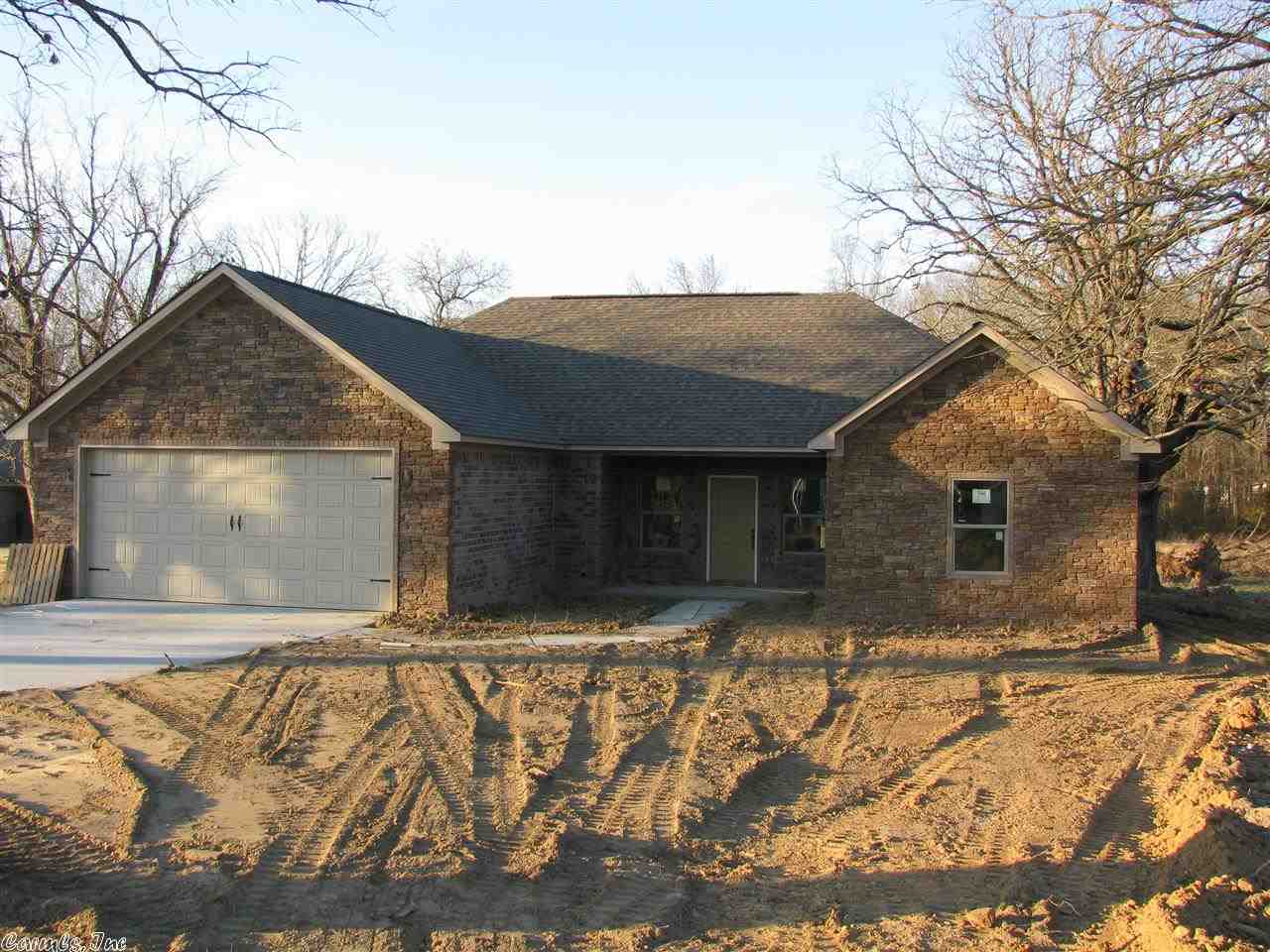 This new construction home features stained concrete flooring throughout, granite tops in kitchen, blown fiberglass insulation, Low E windows and much more. All located on a tree covered 1 acre lot.