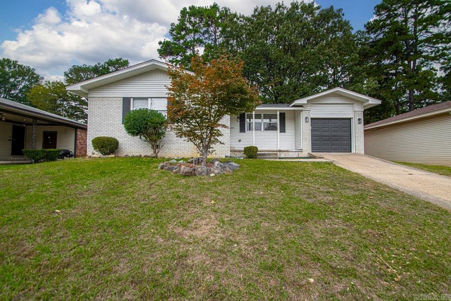 Fully remodeled from top to bottom, this 4-bedroom, 2-bath home is move-in ready and packed with updates! The open-concept kitchen shines with brand-new white cabinetry, quartz countertops, subway tile backsplash, stainless steel appliances, and modern lighting. A large peninsula overlooks the living area, perfect for entertaining or family gatherings. Fresh neutral paint, crown molding, and rich wood flooring flow throughout the main spaces, with new carpet in the bedrooms. Both bathrooms have been completely renovated with timeless tile and updated fixtures. Spacious laundry room with added storage. Enjoy a fenced backyard and French doors leading to the patio. Conveniently located near shopping, dining, and schools, this home combines style, comfort, and functionality in every detail.
