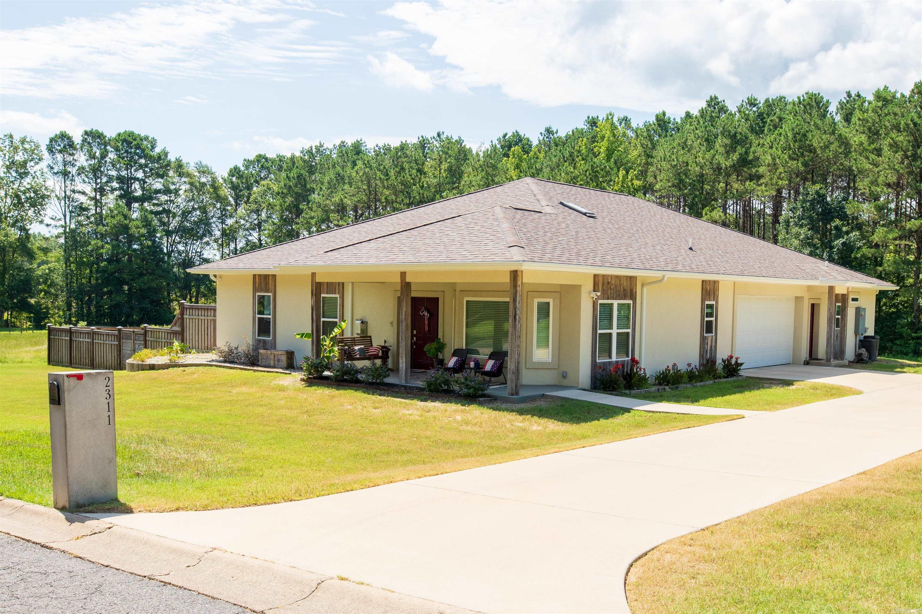 Discover peace of mind, energy efficiency, and modern comfort in this one-of-a-kind FORTIFIED Goldācertified Arkansas homeāengineered to withstand EF-3 tornadoes. The thoughtfully designed layout features a 3-bedroom, 2-bath main home plus a separate 1-bedroom, 1-bath apartment with private entranceāperfect for guests, in-laws, or rental income. Built with 6-inch reinforced ICF exterior walls, this home delivers superior insulation and storm resistance while keeping utility costs impressively low. Inside, enjoy premium upgrades including heated bathroom floors, a jetted tub, a built-in towel warmer, and an auto-closing skylight. The spacious primary closet doubles as a concrete safe room. Smart-home tech offers full control of lighting, climate, and security. A 3kW solar array generates $400ā$500 annually, 2 ZeroSurge panels provides protection for 10 circuits, and dual EV chargers add future-ready convenience. Additional features include a semi-conditioned attic, Haiku fans, and a fenced backyard pre-wired for a pool. With exceptional energy savings plus rental income, this home delivers unmatched value, next-level convenience in a quiet neighborhood.