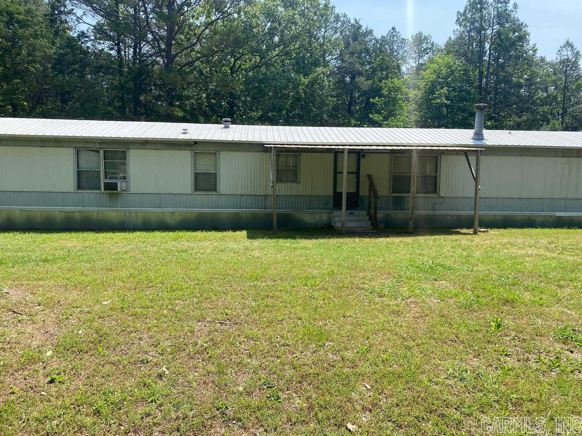 1991' manufactured home, single wide. Close to lake and launch ramp end of Silver Ridge Rd. and close to Tannenbaum Golf Course. 2 bedroom, 2 bath. Detached boat and/or lake toy storage. Approx. 1 acre of land. Being sold "as is".