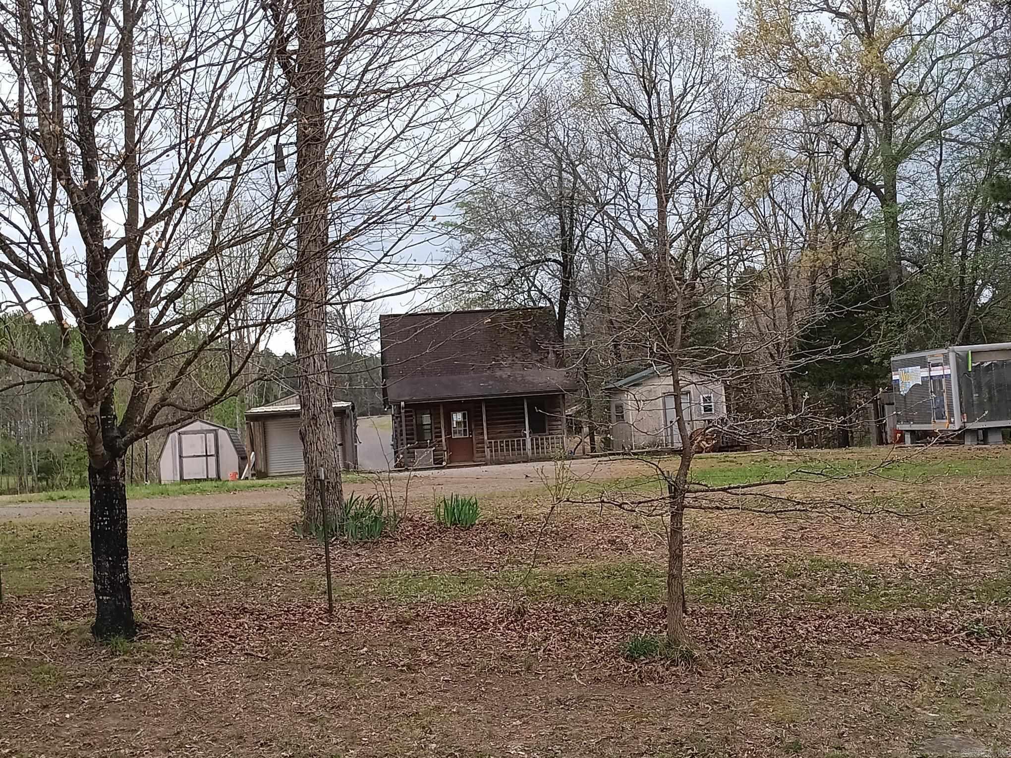 Small cabin with bedroom upstairs & front porch with a bathroom & kitchenette on 15 unrestricted acres previously Rosebud Off Road Park & also a towing company. It could be opened back up & operated or just used as a hobby 4-wheel riding area. Could be used as residential, hobby farm, business & or work from home. Needs repair & some clean up but listed as a fixer upper. There are several storage buildings, containers for storage & even an old mobile home & shop on the property. The entire property is fenced. Property is in probate & will be sold "As is". No owner financing. RD, FHA or VA loans will be considered only Conventional In-House Loans or Cash. See agent remarks.