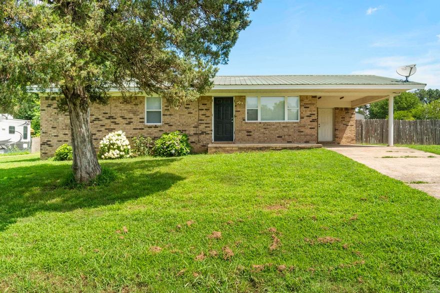 Welcome Home! This charming 3-bedroom, 1-bathroom home sits on a peaceful half-acre lot outside the city limits, offering the kind of quiet comfort and space that’s getting harder to find. Built on a slab foundation, this home offers a functional layout filled with natural light and large fenced-in backyard. With a welcoming layout, cozy living space, and thoughtful updates throughout, it’s move-in ready and waiting for you! New updates are new luxury vinyl plank flooring in majority of the home, fresh paint, nice light fixtures, brand-new hot water heater, and more. Simple yet stylish, the kitchen offers just the right blend of comfort and convenience for everyday living.  Outside, you’ll love the convenience of the carport, plus a storage shed for all your tools and toys. There’s plenty of space to garden, play, or simply soak in the slower pace of life. HVAC (2021) Metal Roof (2013) All windows were replaced by previous owners and are energy efficient.   This home has been cared for and is move-in ready - just waiting for someone to make it their own. Come experience the quiet charm this place has to offer!