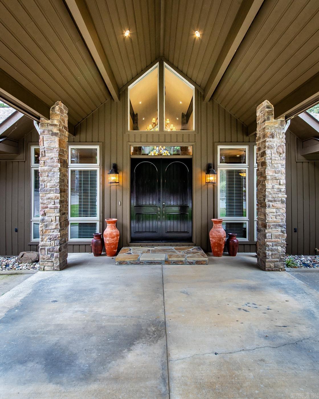 Eden Isle Golf Course Hole 9 is your view! Just a golf cart ride from Greers Ferry Lake and Marina. Fireplace in living and in den. Built in shelving in primary bedroom, walk in shower, separate jetted tub, well designed closet w/tons of built ins. Large laundry room with lots of storage/pantry. Screened in outdoor kitchen. Extensive drainage system around home. Storage under home for lawn stuff. Roof replaced 4 or 5 years ago, 2 AC units (Zoned), Painted exterior '23, replaced 2 water heaters recently. Fire pit on porch, 6 inch walls. Sealed patio every 2 years, new fiber cable to house, 3 car garage with heated room off garage.
