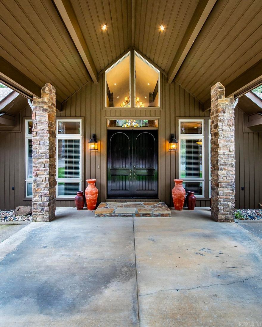 Eden Isle Golf Course Hole 9 is your view!  Just a golf cart ride from Greers Ferry Lake and Marina.  Fireplace in living and in den. Built in shelving in primary bedroom, walk in shower, separate jetted tub, well designed closet w/tons of built ins. Large laundry room with lots of storage/pantry. Screened in outdoor kitchen. Extensive drainage system around home. Storage under home for lawn stuff. Roof replaced 4 or 5 years ago, 2 AC units (Zoned), Painted exterior '23, replaced 2 water heaters recently. Fire pit on porch, 6 inch walls. Sealed patio every 2 years, new fiber cable to house, 3 car garage with heated room off garage.