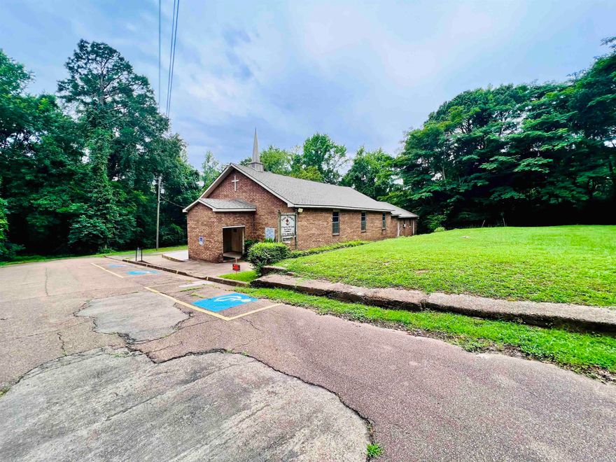 Presenting a unique residential development opportunity at the dead end of a quiet city street. This former church property, situated on three parcels totaling approximately 1 acre, is now available for sale and is zoned residential, offering tremendous potential for transformation.  With over 3,000 square feet of usable space, the property includes a large sanctuary, three offices, and four half-baths. The expansive layout provides ample room for conversion into multiple apartments or a single, spacious private residence. All existing fixtures, including pews, stove, and other items, will convey with the sale, allowing for a smooth transition for redevelopment. This property is being sold as-is, with measurements deemed approximate. The land is currently tax-exempt, with taxes based on the newly acquired vacant lot status. For an accurate tax estimate, prospective buyers are encouraged to contact the county assessor directly. This rare offering is perfect for developers or homeowners looking to create something truly unique at the end of a city street. The possibilities are endless—don't miss the chance to reimagine this property into your next dream project!  BEING SOLD AS-IS