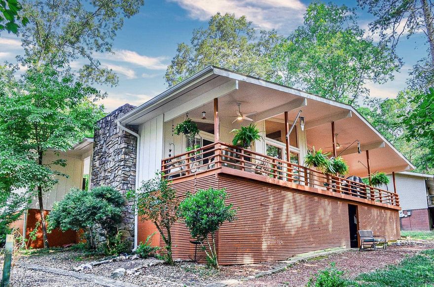 Welcome to this beautifully updated home in Hot Springs Village! As you enter, you will be greeted by a beautiful stone fireplace, new lighting, new ceiling fans, newly updated kitchen with stainless appliances and new windows and doors.  This home boasts three bedrooms and two full bathrooms, and spacious living area. Step outside onto the large deck and enjoy the peaceful surroundings, with walking trails nearby for outdoor enthusiasts. Hot Springs Village offers a plethora of amenities for residents to enjoy, making it a fantastic place to call home. Located in the Jessieville School District and close to the west entrance gate of Hot Springs Village, this home is conveniently situated for families. Don't miss out on the opportunity to own this updated gem in a prime location!