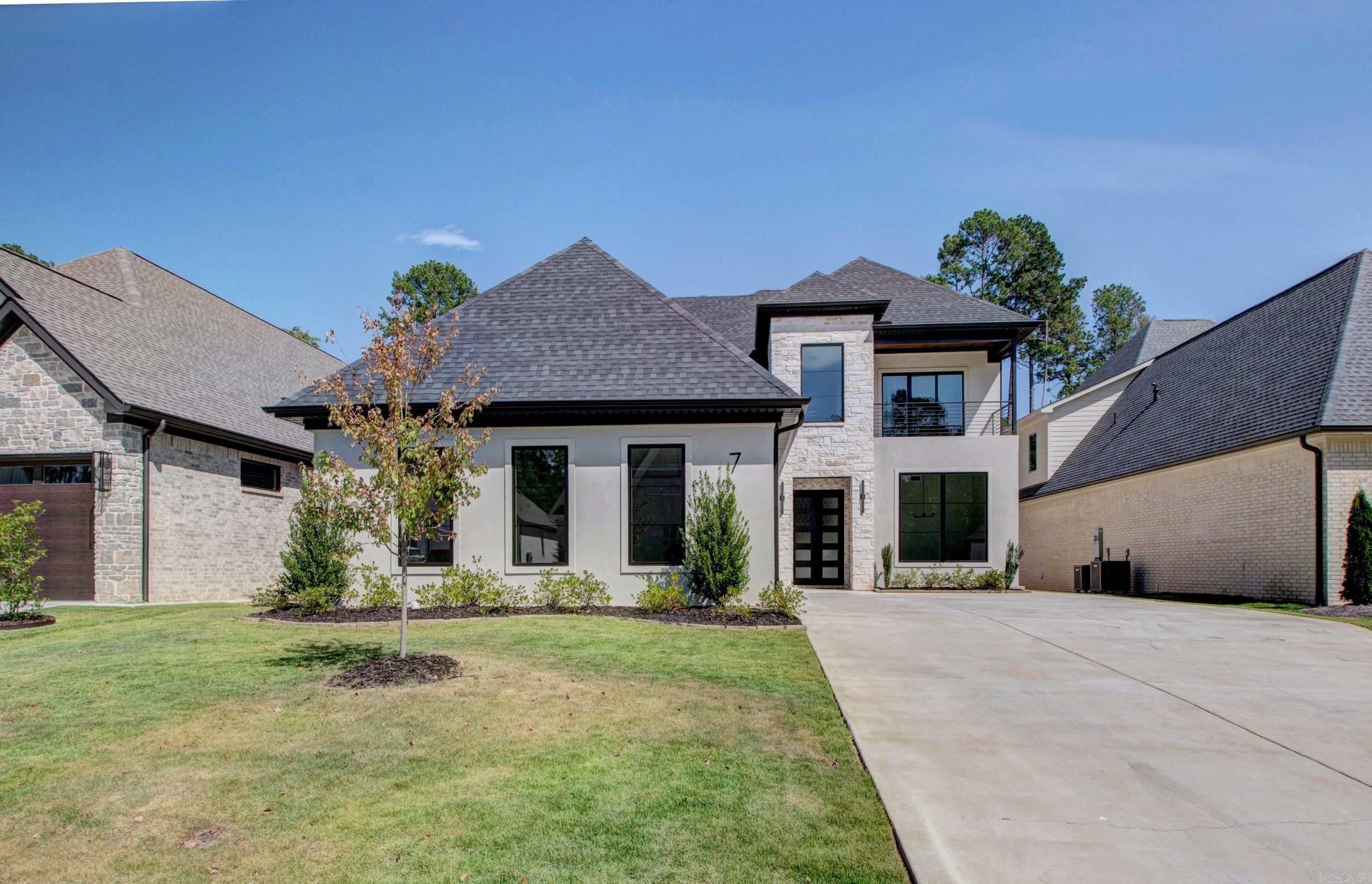 GATED neighborhood! One of Chenal's newest golf course neighborhoods that is conveniently walkable to shopping, dining and entertainment. Home is stunning and boasts five bedrooms, four full baths plus two half baths. Open floor plan, beautiful fireplace and knock-out kitchen equipped with refrigerator/freezer combo and double ovens. Butler's pantry. Primary suite and two additional bedrooms with their own baths are located on the main floor. Upstairs is the game/media room with its own half bath and two bedrooms with bath between. Outdoor kitchen and fireplace. EV charger and epoxy flooring in garage. Fully fenced w/ green space behind. Meticulous attention to detail! 3 fireplaces throughout. Lots of natural lighting. Call for list of extra's.