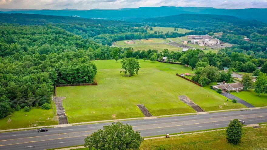 Don't miss this exceptional real estate opportunity—11.79 acres of prime land located directly on Highway 65, offering high visibility and a strong daily traffic count. This versatile property features multiple entrances and is partially fenced, with breathtaking views of the surrounding mountains, pastures and baseball fields. With its strategic location and expansive space, it’s ideal for a wide range of development possibilities including a subdivision, restaurant, hotel, retail center, or commercial business. Don’t miss your chance to invest in one of the most desirable and high-potential tracts in the area.