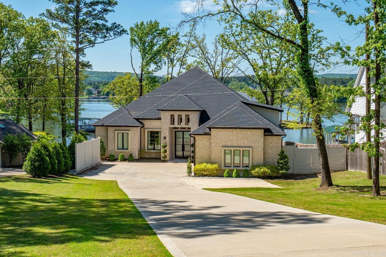 Luxury lake living you have ever only dreamed of! This 5 bed,5 1/2 bath home was made with comfortable luxury in mind. From the massive great room to the sprawling gourmet kitchen your home is perfect for entertaining. Breathtaking views from every direction. Escape to your private oasis when you enter the Master en suite with huge shower, freestanding soaker tub, and phenomenal walk-in closet. Outdoor kitchen with fireplace is an extension of your living spaces and will be the favorite of all who visit whether for a fun day on the water or relaxing at the end of a long week. Watch the sunset on the water as you lose yourself in sweet summer skies and another day closes on your very own fairy tail...because dreams do come true!