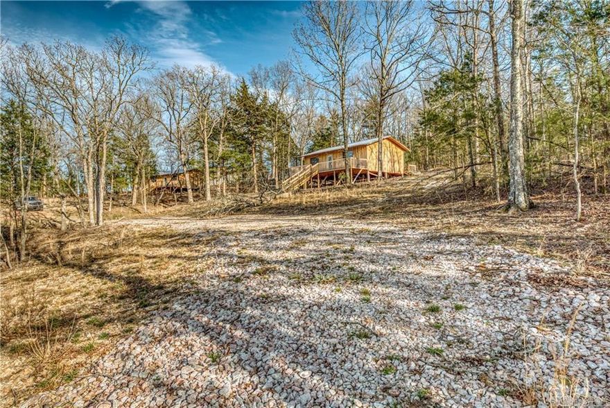 Owner Financing Available with Acceptable Terms! Amazing property in Peel, Arkansas! It's 13 acres of beauty with partially cleared acreage, with two unfinished cabins, and two more pads for additional cabins. The well is already drilled, but we'll need to get the electric installed before the well pump can go in. This place has so much potential, and just minutes away from Bull Shoals Lake just adds to its charm. Can't wait to see what we can do with this adorable property! 11 miles to Diamond City Marina & 7.5 miles to HWY 125 Peel Marina for fishing & boating. Seasonal Spring is located on the property.