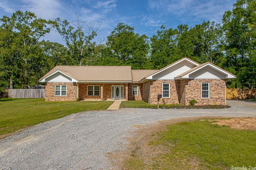 No detail was overlooked on this custom built home located on acreage. Don't miss the opportunity to make it yours today. This home certainly gives you the warmest welcome as you enter into the spacious living area boasting beautiful hardwood flooring. Open concept kitchen/dining room with plenty of cabinet & countertop space, as well as roll out shelving in the enclosed pantry. Primary suite is massive & includes 2 separate walk-in closets. Primary bath includes jacuzzi tub & double vanities. Second walk-in closet also serves as an 8x8 safe room. This split floor plan home has two spacious spare bedrooms & plenty of storage throughout. Don't forget to check out the office & half bath conveniently located for guest. Outside you will find a solid, fully fenced backyard perfect for entertaining. Pair all of this with a 3 car garage, cellulose insulation for energy efficiency, geothermal water heater, freshly painted walls & a 5 year old metal roof & you're set! Schedule your showing today to see this beauty! You will not be disappointed!