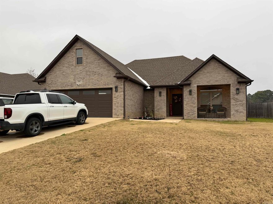 4 bedroom, 2 bath, all brick home featuring 9 ft ceilings, luxury vinyl plank flooring throughout the first floor, large open living/dining/kitchen area, and a covered back patio area.  Gorgeous white kitchen with granite counter tops, and an island with breakfast bar.  Master suite with large walk-in closet, a freestanding tub framed by dual vanities and a separate shower.