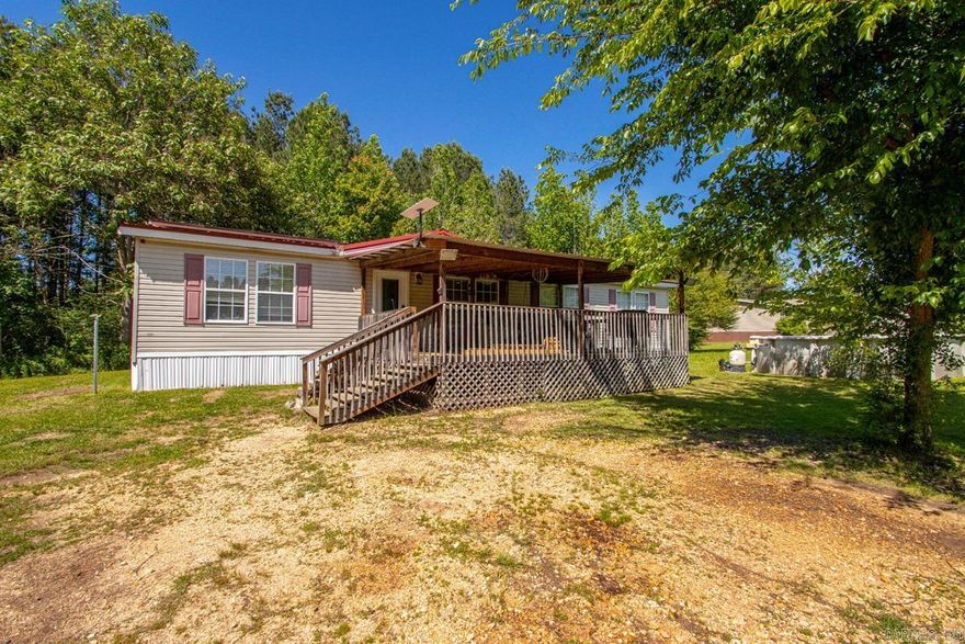 A spacious, custom-built manufactured home on 2 acres within the Sheridan Schools district, with a Redfield mailing address. Move-in ready and designed for relaxed living. The heart of the home is a large kitchen featuring a breakfast bar, island, abundant counter space, extensive cabinetry, and like new appliances. The adjacent dining area is bright and inviting. The oversized living room boasts newer flooring and a fireplace accented by a faux stone wall. The master suite includes a huge tub, separate shower, Corian-style countertops, and a large walk-in closet. Additional highlights include high-quality insulated windows, a 24x16 deck, a durable metal roof, and an above-ground pool. A well-appointed laundry room. New hot water heater. On a permanent foundation and solar panels.