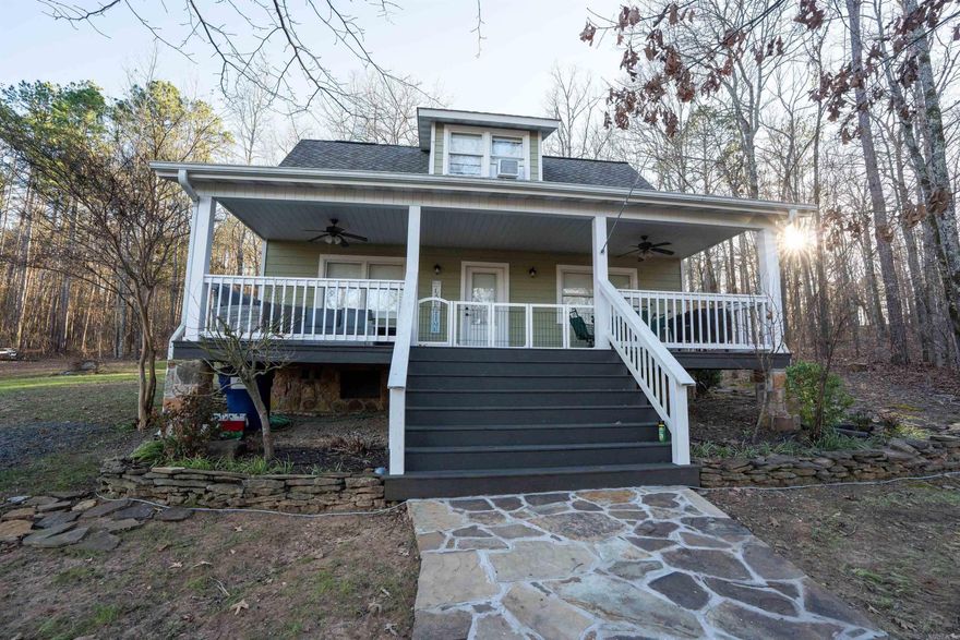 Rare find in Sylvan Shores! This charming 1.5 story lake-view home offers both beauty and versatility near Greers Ferry Lake.  The main level features a thoughtfully designed layout with spacious living areas and abundant natural light, while enjoying peaceful views of the lake and surrounding nature.  The upper level functions as a private apartment complete with its own kitchen and full bathroom, making it ideal for guests, extended family, rental income, or a mother-in-law suite.   This property offers lake views and a rare 15-foot-wide deeded and recorded easement providing access to Greers Ferry Lake--perfect for boating, fishing, and enjoying the lake lifestyle. With its peaceful setting, flexible layout, and proximity to the water, this home is ideal as a primary residence, vacation getaway, or investment property. See agent remarks.