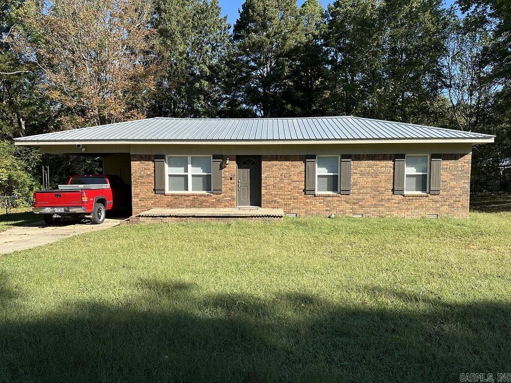 Totally Remodeled Brick Home! Renovation completed in 2023. New Metal roofing, HVAC unit, Vinyl windows, flooring, paint, light fixtures, interior doors and hardware. Kitchen completely new w/granite conters, white soft close cabinets, appliances, island w/seating, stainless steel sink & faucet. Two new full baths, Hall BA - whirlpool tub/shower, tile surround, vanity & toilet, Master BA with walk in shower, vanity & toilet. Large fenced barkyard with a 192 SF wood deck. The property extends beyond the back fence to a wet weather creek. Sulfer Creek Trail with hiking and biking located a few blocks away. Downtown Heber Springs shopping & dining a short drive!