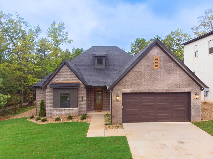 Welcome to 15109 Matterhorn Loop! This home has a waterfront view of the Pond!   This move in ready home is located in the desirable Phase 2 of Stonebrook. Stonebrook was Voted AY Magazines Best Neighborhood in Central Arkansas! Enjoy gated privacy, scenic walking trails, a private lake, and community amenities in one of the most sought-after neighborhoods in Maumelle! Spanning 2,510 square feet, this beautifully designed residence offers the perfect blend of comfort, luxury, and natural beauty.  Boasting 4 generously sized bedrooms and 3 full bathrooms, this home is ideal for families or those who love to entertain. The thoughtfully crafted layout includes a spacious open-concept living area, a gourmet kitchen with premium finishes, and large windows that fill the space with natural light.  Set on a prime lot, this home offers unparalleled outdoor living with green space behind and a stunning waterfront view of the pond. Whether enjoying a morning coffee on the patio or hosting gatherings, the serene backdrop creates the perfect oasis.  Set up a self guided tour of this home on the Hines Homes website.