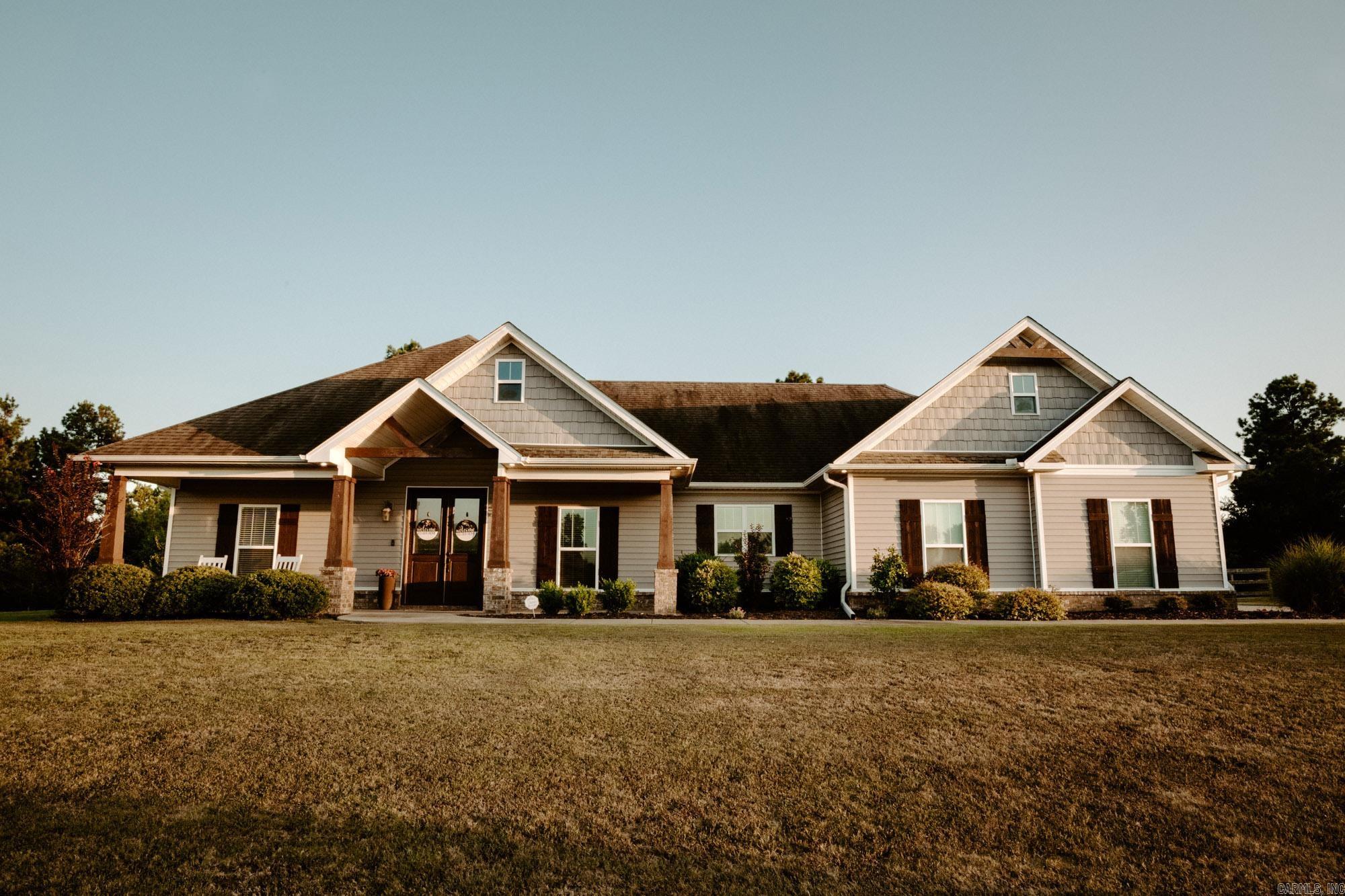 Enjoy peaceful country living on 3.5 acres in a wonderful neighborhood with just the right amount of space between homes—offering privacy without feeling isolated. Walk into this beautiful home through double doors to a spacious split-bedroom floor plan with 4 bedrooms, 2.5 bathrooms, and a dedicated office—perfect for work-from-home or study needs. The open living area flows seamlessly into the kitchen, which includes a breakfast bar and a separate dining area, ideal for everyday meals and entertaining. Interior finishes include hardwood flooring in main areas, tile in wet spaces, and cozy carpet in the bedrooms. The primary suite offers plenty of space and includes a tray ceiling and a large walk in closet. The kitchen is nice sized with lots of cabinets, granite countertops, dedicated pantry with pullout drawers, large window over the kitchen sink overlooking the front yard and stainless appliances. The living area has detailed coffered ceilings, lots of crown mold and a real wood stone fireplace. Side load two car garage and a seperate large laundry. The back yard features a fenced in area and covered back porch. You will love the country feel! Make an appt today!