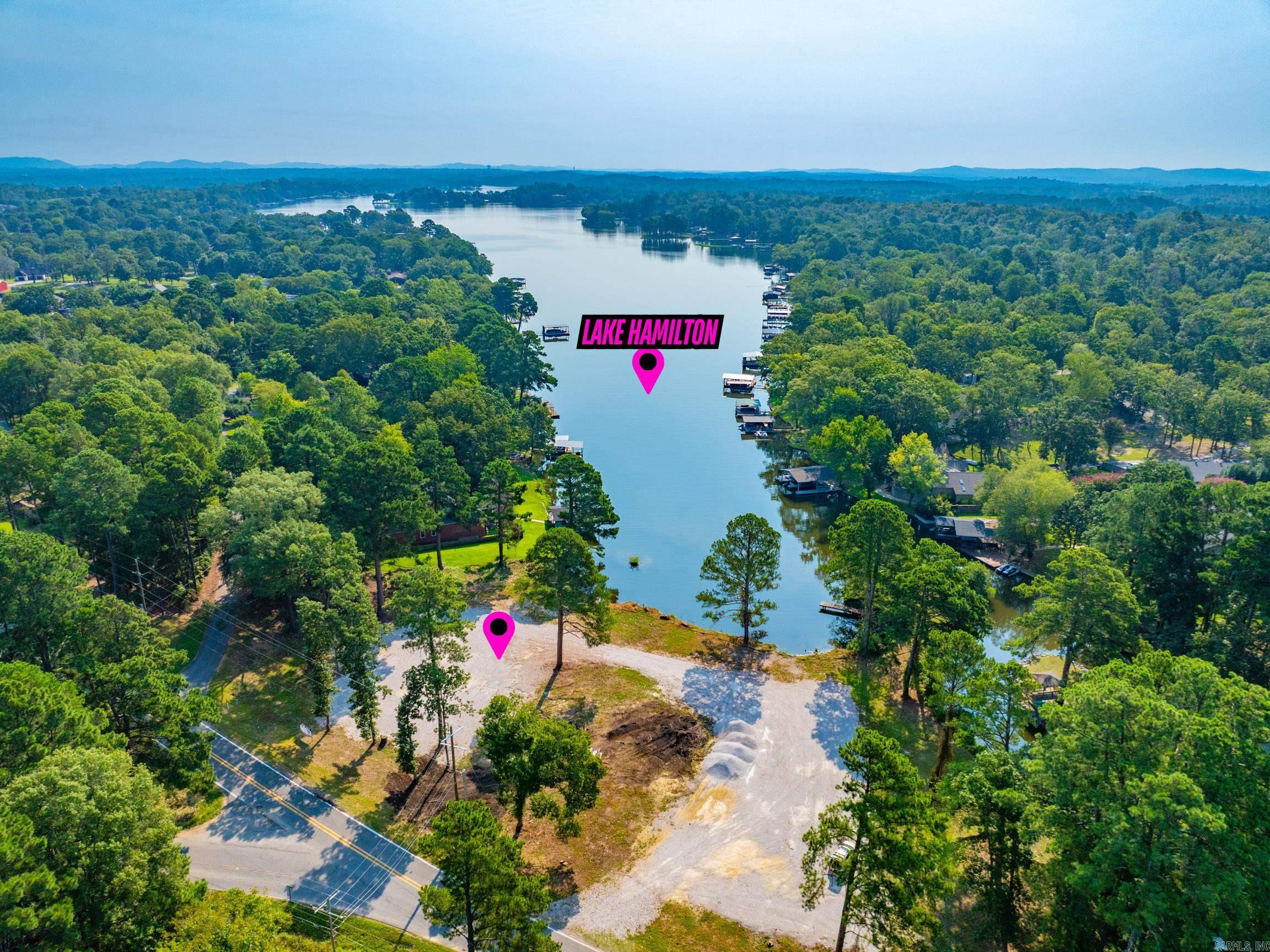Build your dream home or your lake front retreat on this Lake Hamilton property in Lake Hamilton School District. This expansive lot offers the ideal setting to design and build your custom luxury home in a highly desired area. Utilities at road. No HOA. This property is a blank canvas with endless possibilities for your dream lifestyle. Don't miss this incredible opportunity to own a piece of paradise!