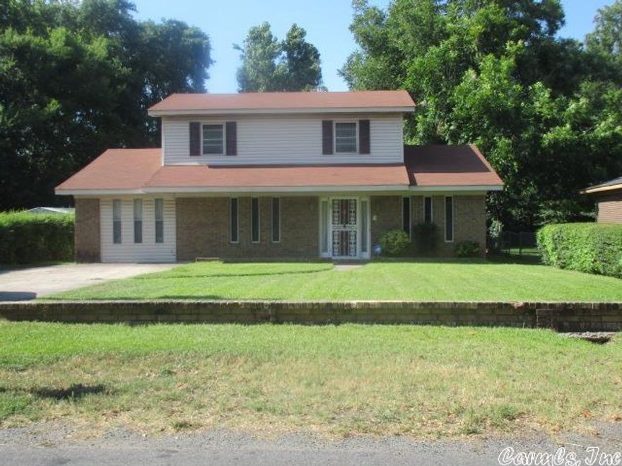 INVESTORS take note.  This home is a 5 bedroom, 3 1/2 bath home, close to UAPB.  This brick and vinyl siding home needs a few personal touches to make it your dream home or a wonderful rental!!  3 bedrooms, 1 bath upstairs.  Lots of storage, large rooms, great storm doors, outside storage building.  Call today for your personal tour.  Agents see remarks**