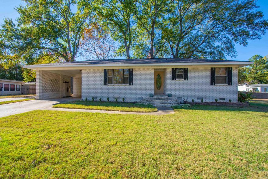 Well maintained & Move in Ready Brick Home and 20x24 shop on two lots with a third lot beside the home.  Two living areas, formal dining room, eat in kitchen & separate laundry with storage.  New Electric Log Fireplace, Tankless water heater, no carpet-All wood flooring.  Level lot, extra parking pad, patio & deck.  Washer/Dryer & Refrigerator convey with property.