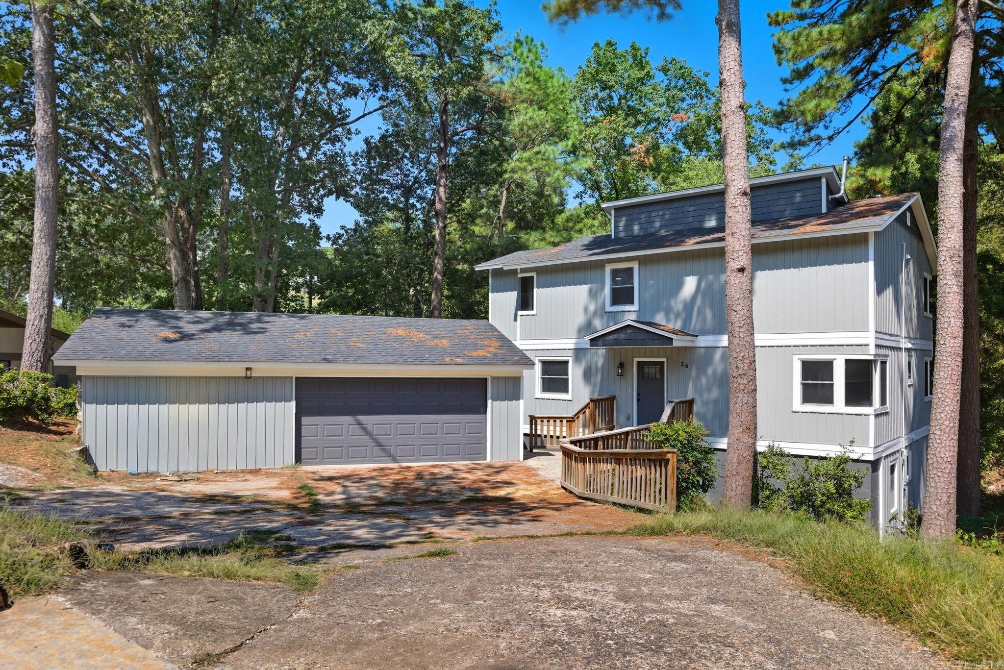 Welcome to 26 Tallyho Lane tucked into the Foxcroft Subdivision. This home is move-in ready! Spacious 5-bedrooms, 4-bathroom home spanning nearly 3,000 sqft. Tons of natural light from the floor to ceiling windows. The main level has 2-bedrooms and 1 full bathroom. Upstairs you'll find the primary bedroom with a spacious walk-in closet and bathroom. Additional bedroom and bathroom upstairs. Downstairs you'll find the walk-out basement featuring a wet bar, living area, laundry/utility room, bedroom and full bathroom. For peace of mind and efficiency, new roof, HVAC, water heater, plumbing, insulation and appliances for major items in the home. Just minutes away from shopping, schools and outdoor adventures!