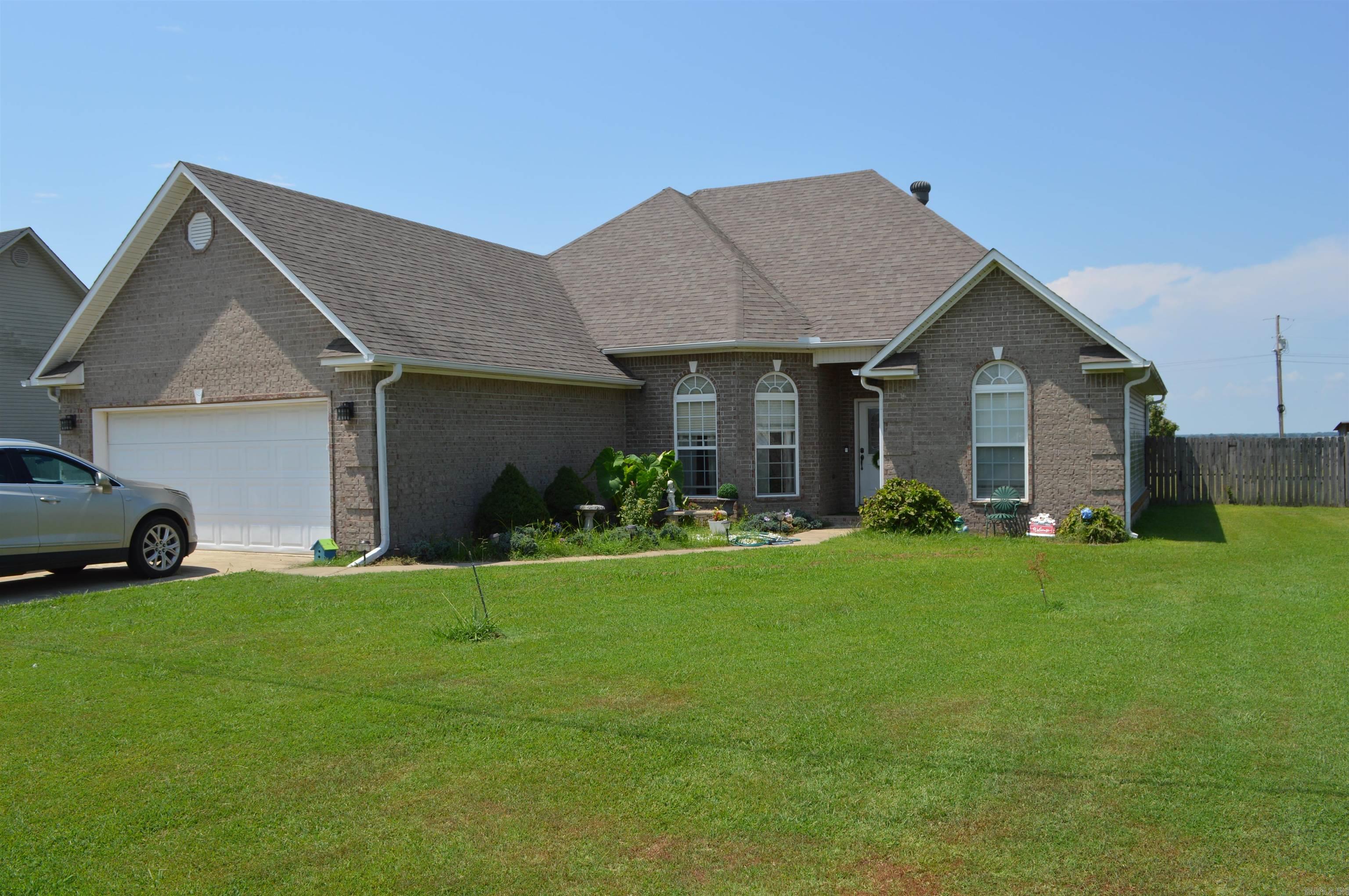 This wonderful home is located in a great neighborhood on the north side of Harrisburg and within an easy fifteen minute drive to Jonesboro. The master bedroom is spacious and has it's own master bathroom with bathtub and walk in shower. Two other bedrooms and a full bathroom is on the main floor also. The living area with large windows and vaulted ceiling is open to the kitchen area. The second floor offers a large room and a half bath that could be either a bedroom or a bonus room. The back of the house has a covered porch and a privacy fenced in large backyard to enjoy with friends and family. Also in the backyard is a insulated 20 X 20 shop building with concrete floor and electricity!