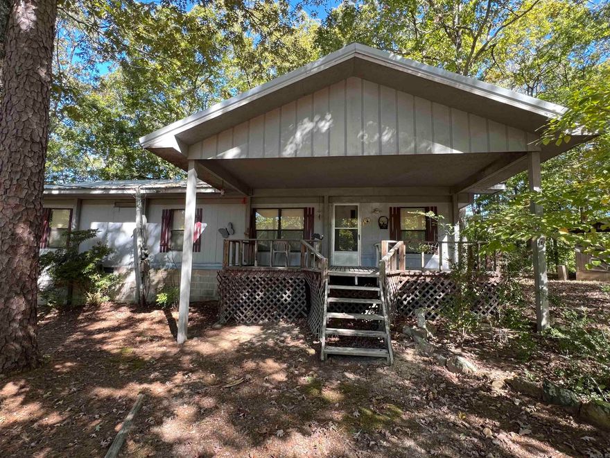 LAKEFRONT oasis on Greers Ferry Lake for sale.  Escape to your serene retreat with this charming 2-bedroom, 1-bath mobile home nestled on 1.59 acres, perfectly situated on the shores of Greers Ferry Lake. Enjoy stunning water views and the tranquility of nature from your own piece of paradise. This well-maintained home features a cozy wood-burning stove, providing extra warmth and ambiance during cooler months. The property comes fully furnished, making it move-in ready! The mobile home is set on a permanent foundation, has a new metal roof, and sits on three spacious lots, offering ample room to expand or build your dream lakefront home while enjoying the comforts of the current residence. With low White Line and Red Line designations, the possibilities are endless! Experience the freedom of no restrictions on property use—perfect for personal enjoyment, investment, or development. Mineral Rights do not convey to new owner. Whether you’re looking for a weekend getaway or a year-round escape, this property offers a unique opportunity to embrace the lake lifestyle. Don't miss your chance to own a slice of paradise on Greers Ferry Lake! Schedule your private showing today!